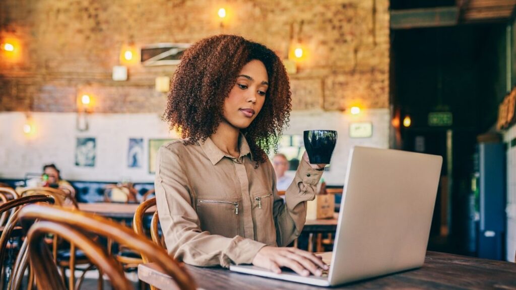 My EHI Aloha 1280 x 720 Woman Working with Computer in Coffee Shop